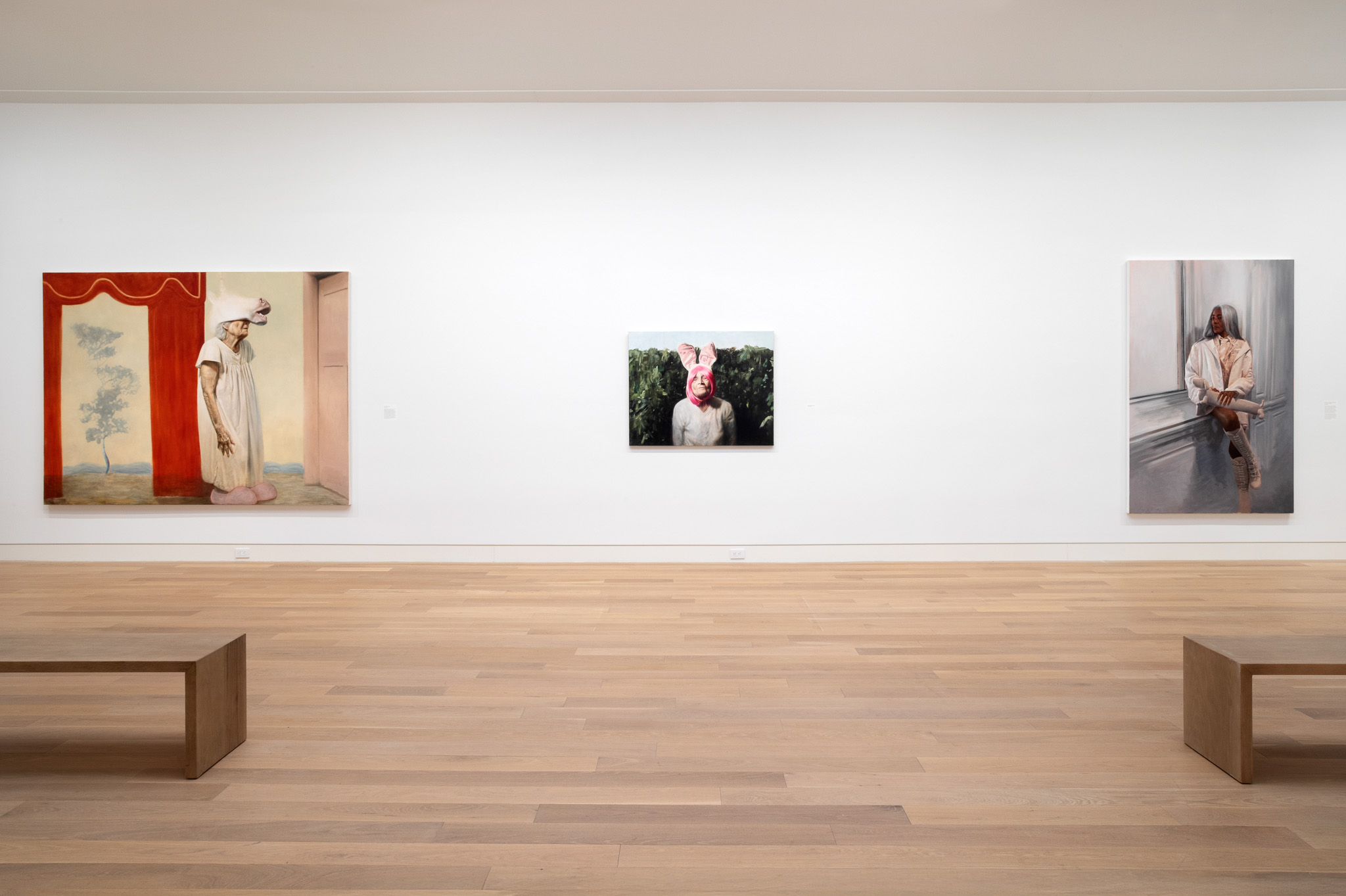 how art exhibitions are curated inside museums in East Hampton art gallery with curator reviewing artwork